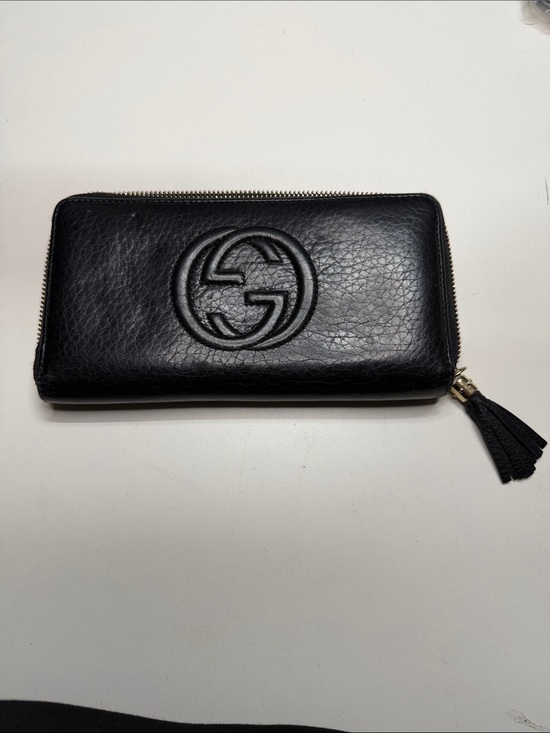 Gucci Handbags - Gucci Black Embossed GG Leather Wallet